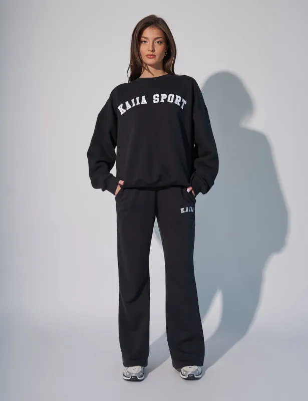 Kaiia Logo Wide Leg Sweat Pants in Black sold by Public Desire