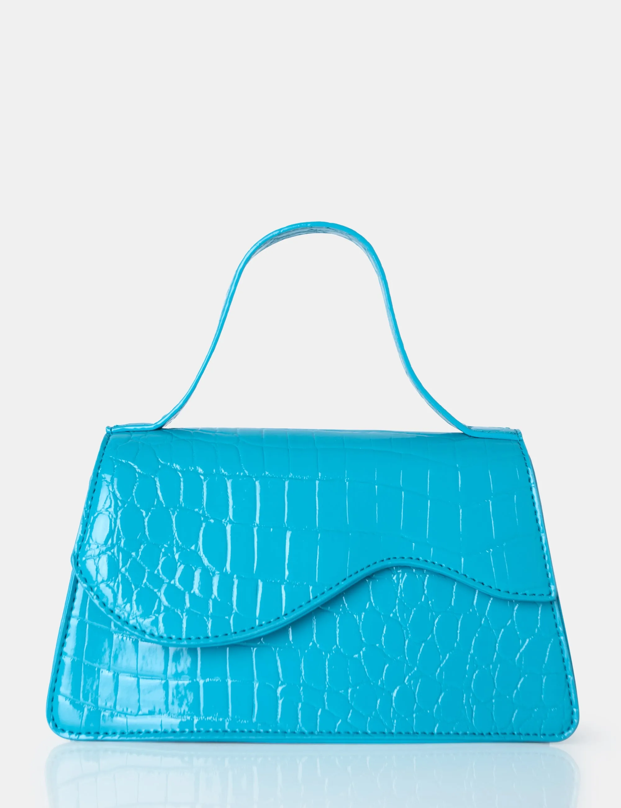 The Polly Blue Croc Top Handle Mini Bag sold by Public Desire