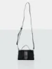 The Mika Black Shearling Mini Bag sold by Public Desire