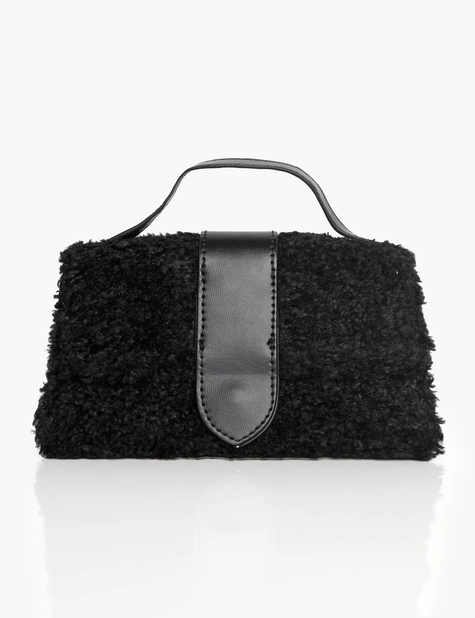 The Mika Black Shearling Mini Bag sold by Public Desire
