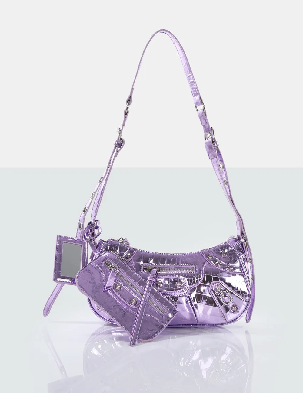 The Trackstar Metallic Purple Croc Pu Studded Mirror Zip Detail Handbag sold by Public Desire