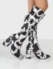 Apology Mono Cow Print Knee High Block Heel Boots sold by Public Desire