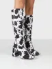 Apology Mono Cow Print Knee High Block Heel Boots sold by Public Desire