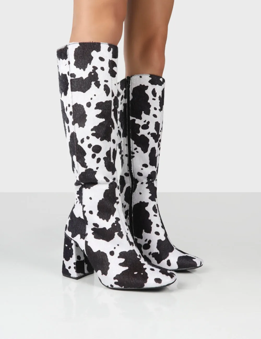 Apology Mono Cow Print Knee High Block Heel Boots sold by Public Desire