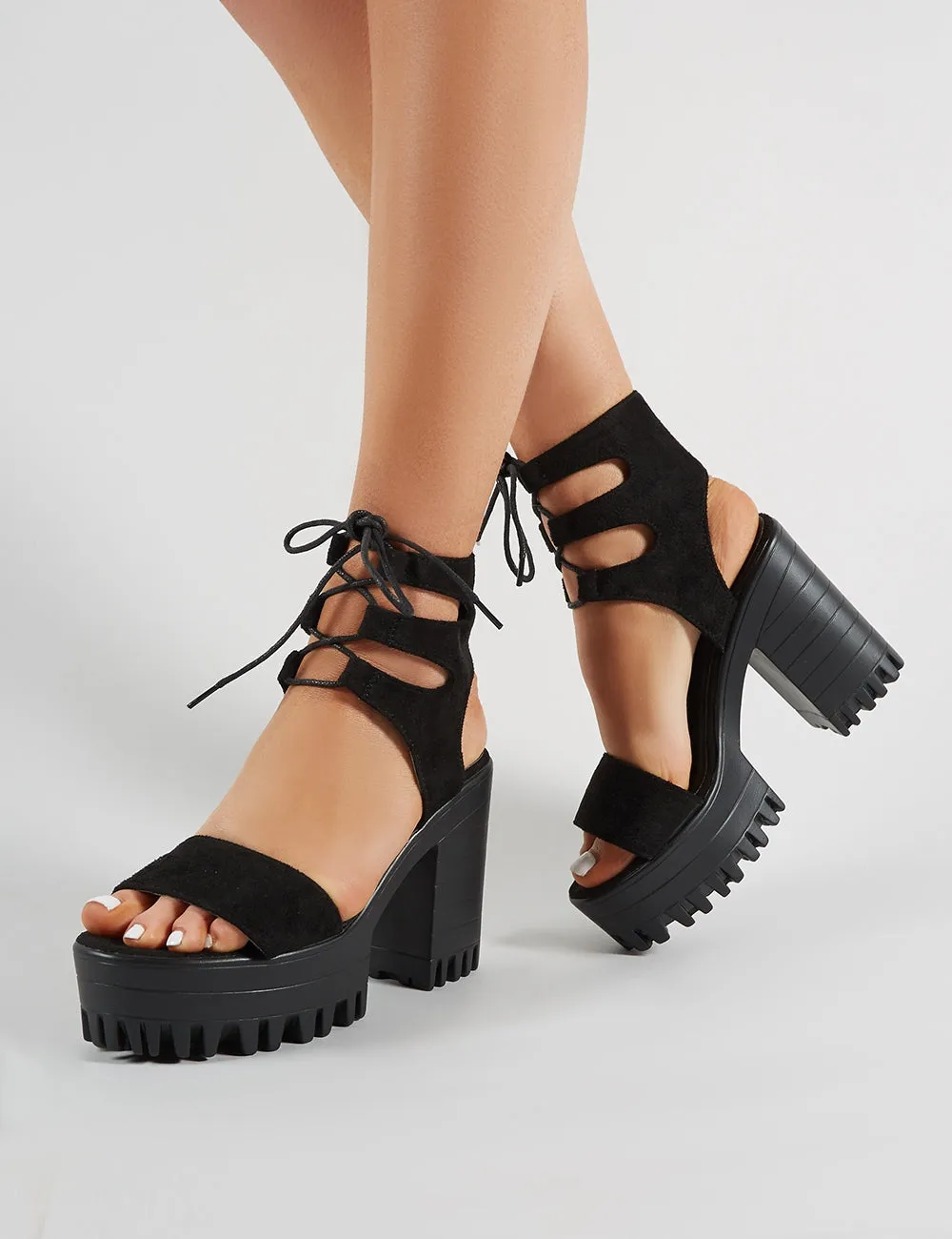 Hailey Lace Up Chunky Heels in Black Faux Suede sold by Public Desire