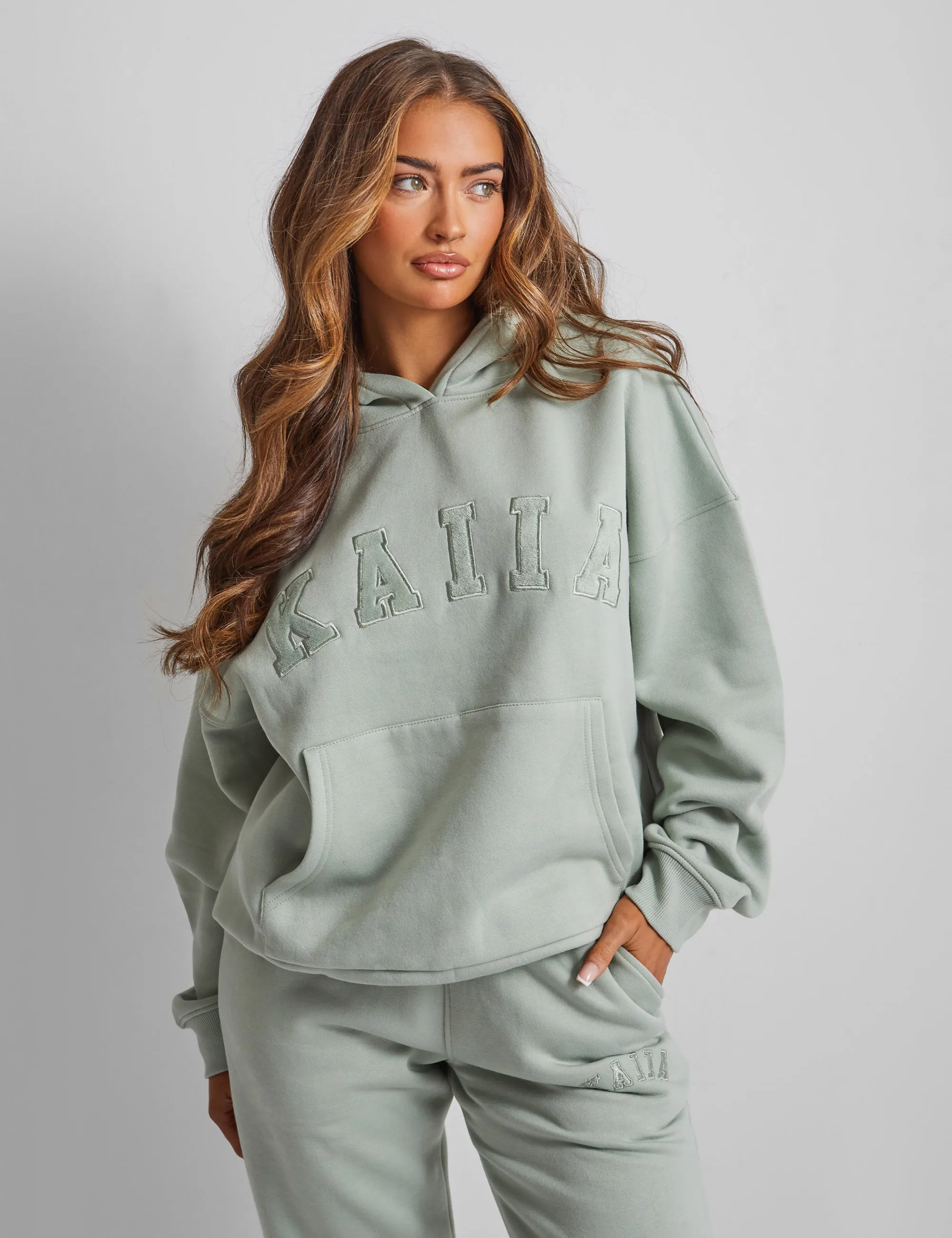 Kaiia Slogan Oversized Hoodie Sage Green sold by Public Desire