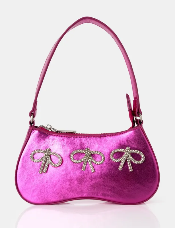The Ariel Metallic Pink Bow Diamante Shoulder Bag sold by Public Desire