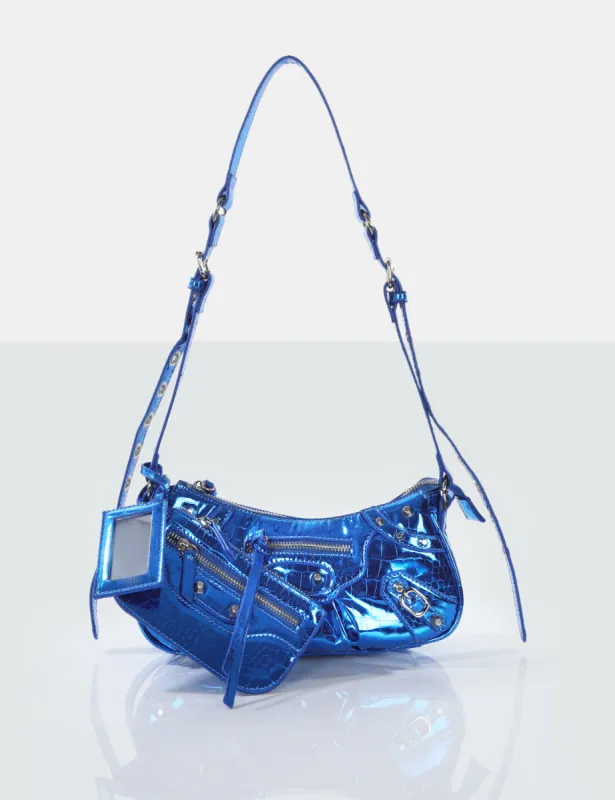The Trackstar Metallic Blue Croc Pu Studded Mirror Zip Detail Handbag sold by Public Desire