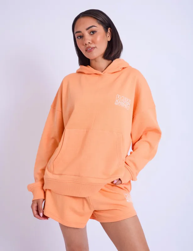 Kaiia Studio Bubble Logo Oversized Hoodie Light Orange sold by Public Desire