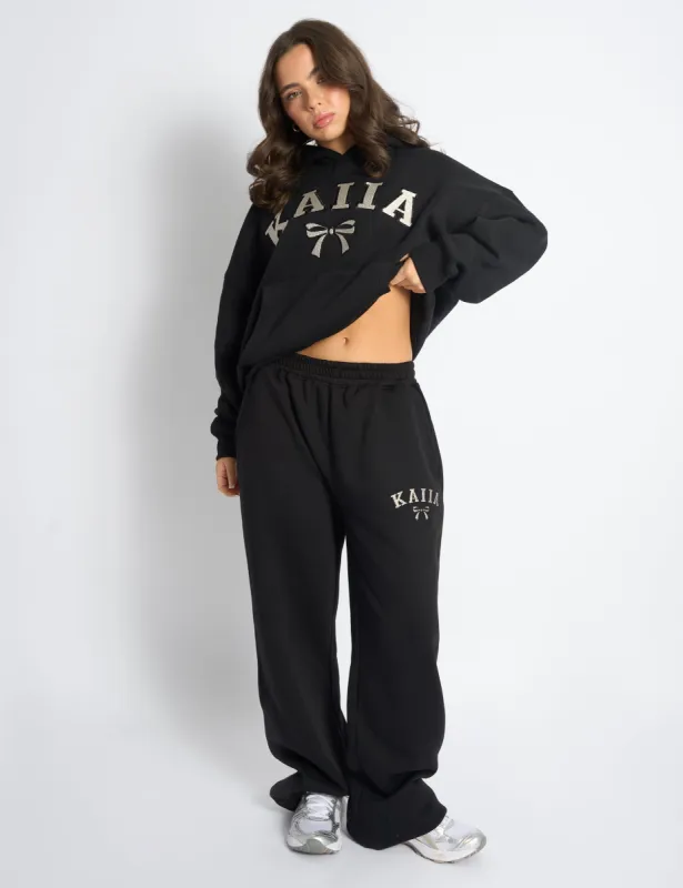 Kaiia Bow Embroidered Ribbed Waistband Wide Leg Joggers Black & Silver sold by Public Desire