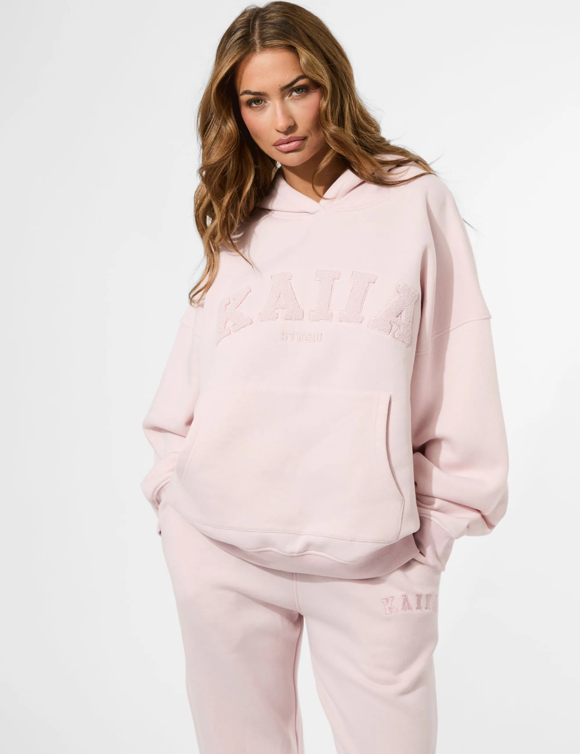 Kaiia Studio Borg Slogan Oversized Hoodie Pink Chai sold by Public Desire