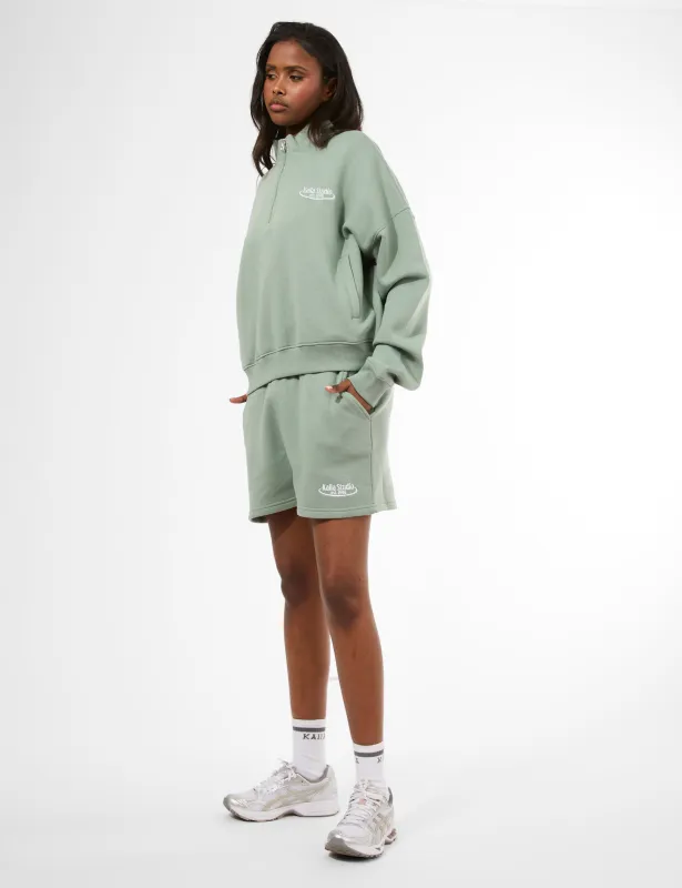 Kaiia Running Club Logo Sweat Shorts Green Tea made by Public Desire