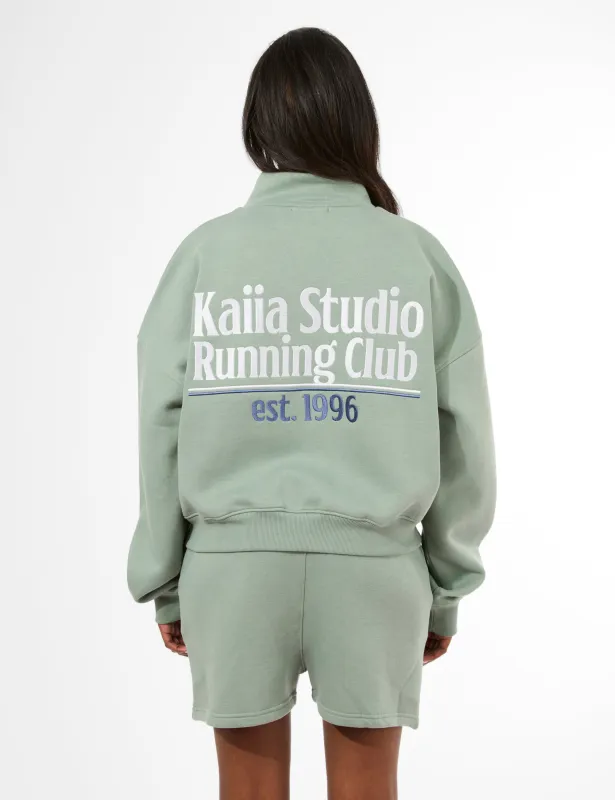 Kaiia Running Club Logo Quarter Zip Sweatshirt Green Tea sold by Public Desire
