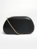 The Fern Black Gold Detail Hard Clutch Bag sold by Public Desire