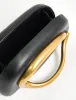 The Fern Black Gold Detail Hard Clutch Bag sold by Public Desire