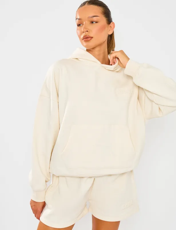 Kaiia Embossed Bubble Logo Oversized Hoodie Almond Milk made by Public Desire