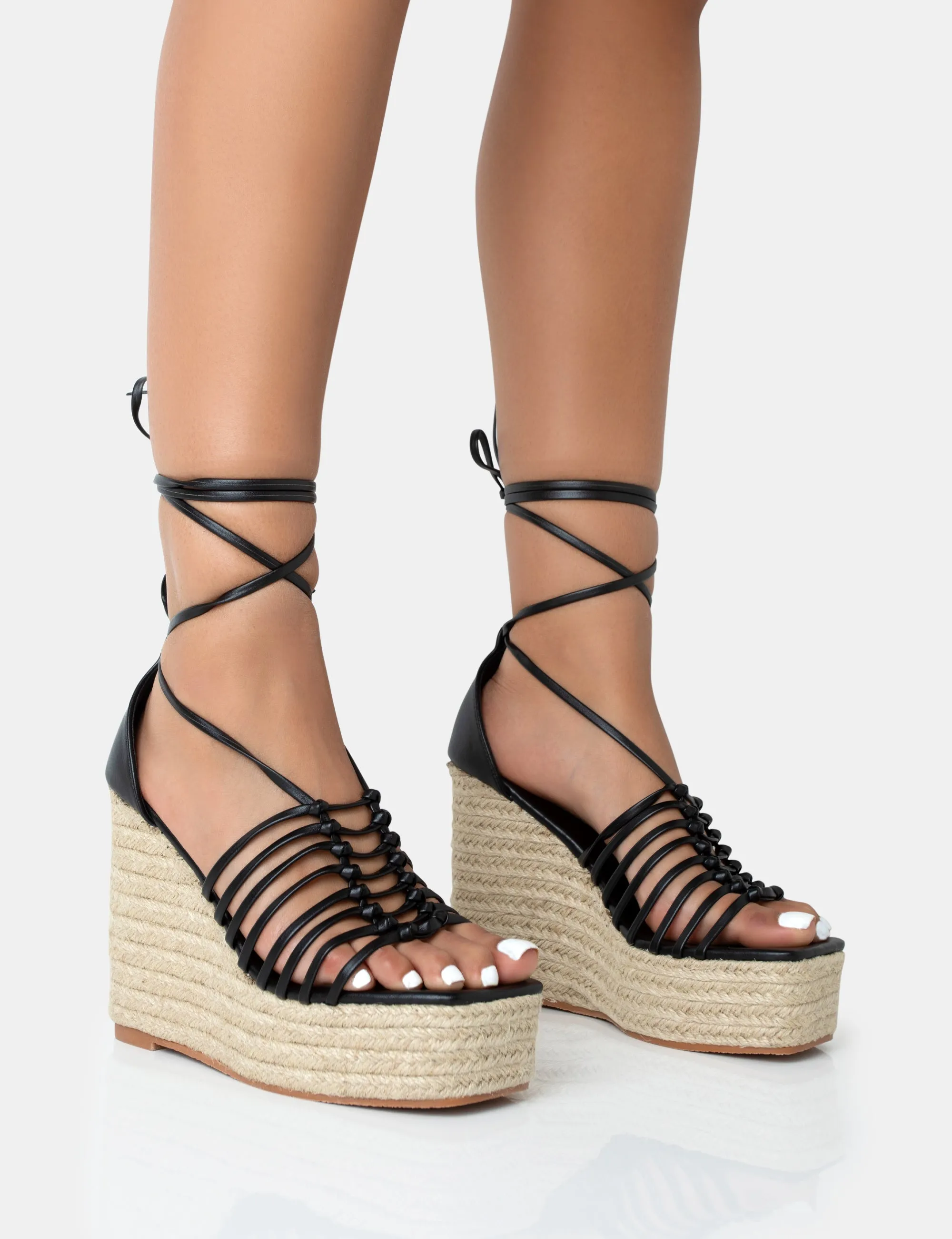Reece Black PU Knot Strap Lace Up Raffia Wedge Heels sold by Public Desire