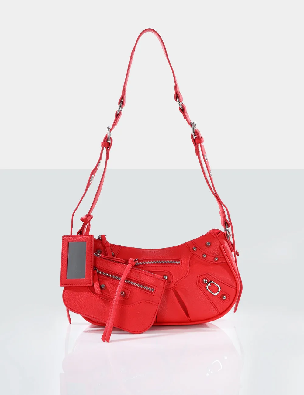 The Trackstar Red Grain Studded Mirror Zip Detail Handbag sold by Public Desire