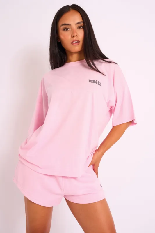 Kaiia Studio Bubble Logo Oversized Tee in Pink sold by Public Desire