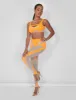 Mesh Insert Leggings Orange sold by Public Desire
