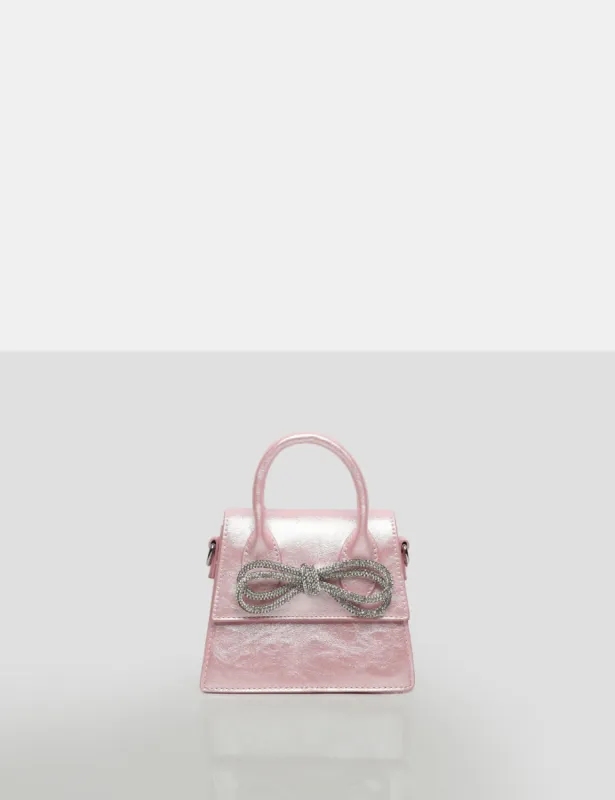 The Indy Pink Pu Diamante Bow Mini Bag sold by Public Desire