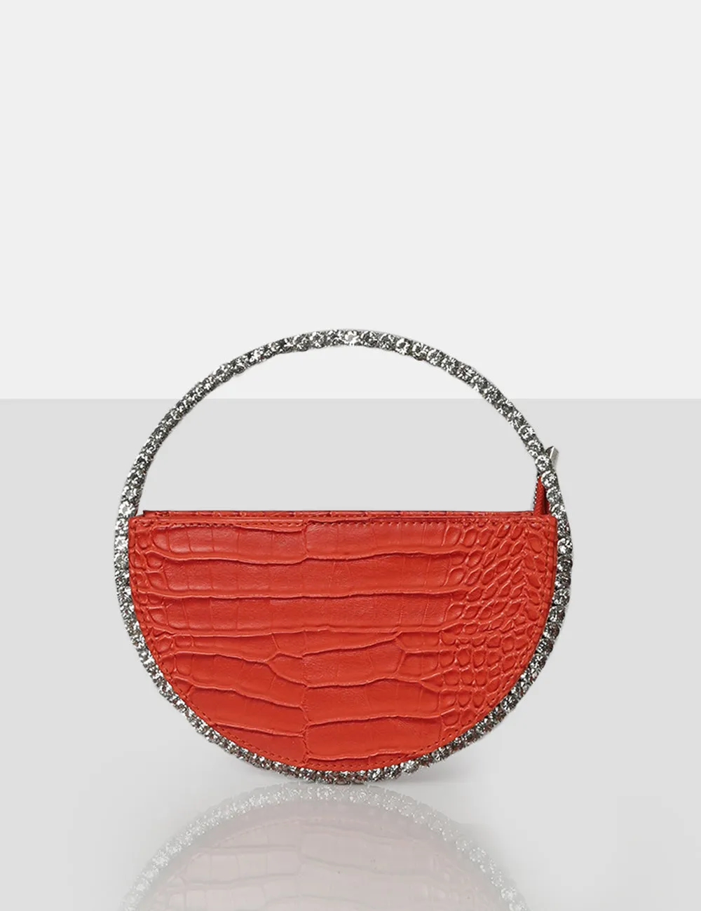 The Alessia Orange Circle Diamante Mini Handbag sold by Public Desire