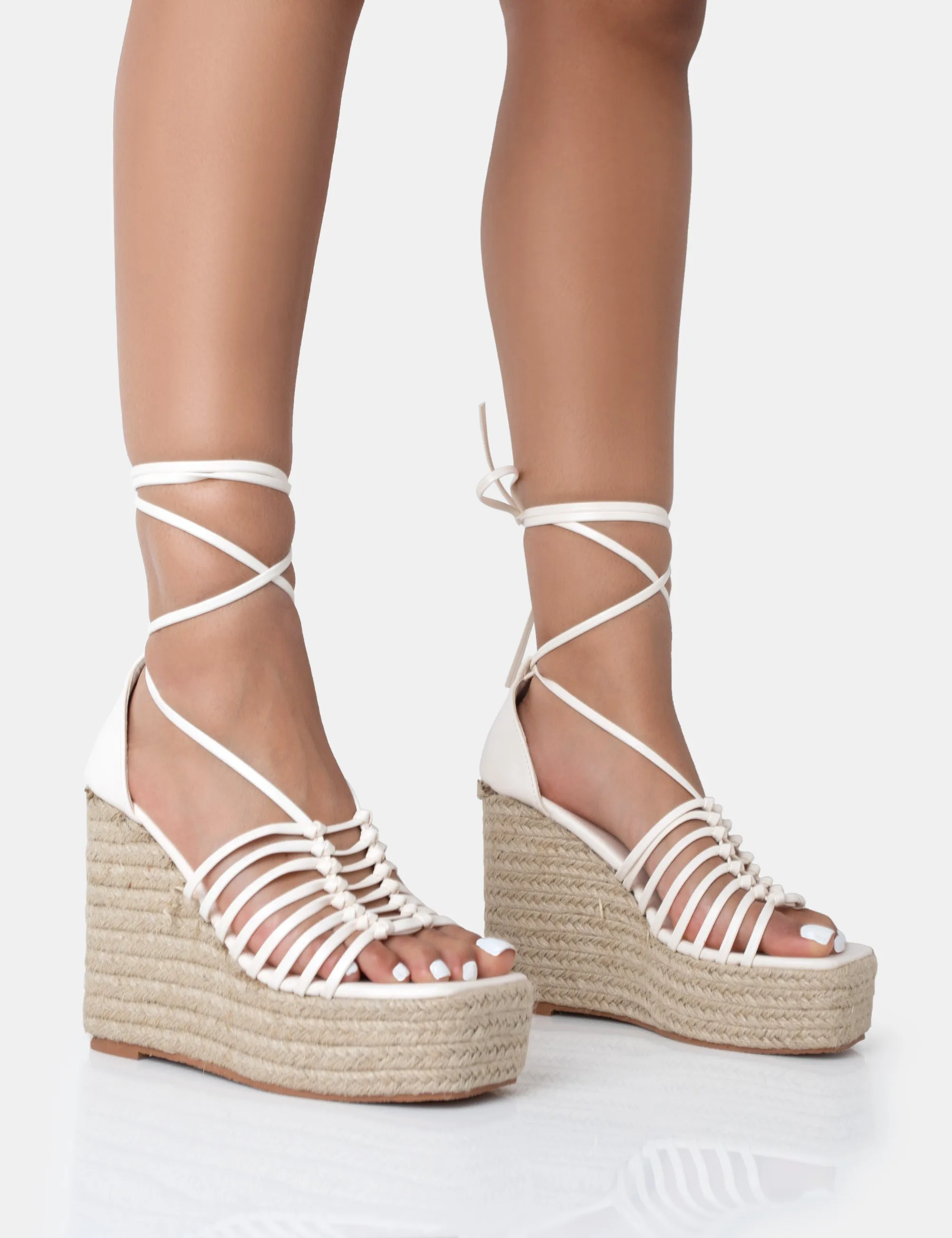 Reece Wide Fit Ecru Pu Knot Strap Lace Up Raffia Wedge Heels sold by Public Desire