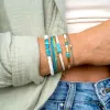 Puka Shell and Turquoise Chip Stretch Bracelet sold by Pura Vida