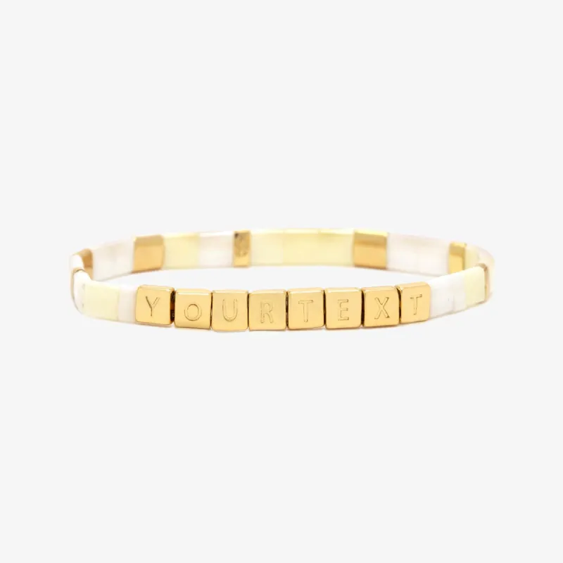 Cream Tile Bead Gold Stretch Bracelet sold by Pura Vida