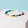Rainbow Tile Bead Gold Stretch Bracelet sold by Pura Vida