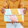 Stripes Not Stripes Clutch sold by Pura Vida