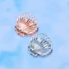 Rose Gold Shell Claw Clip sold by Pura Vida
