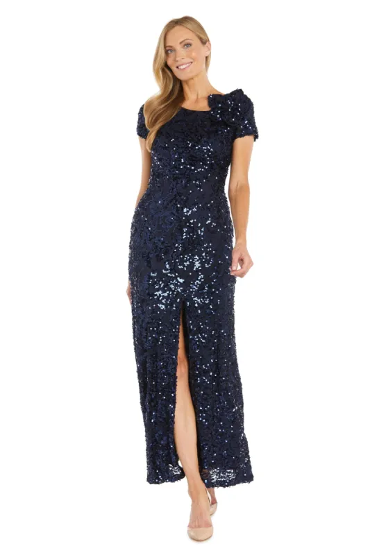 Radiant Bloom: Sequin Gown with High Slit and Floral Shoulder Accent sold by R&M Richards