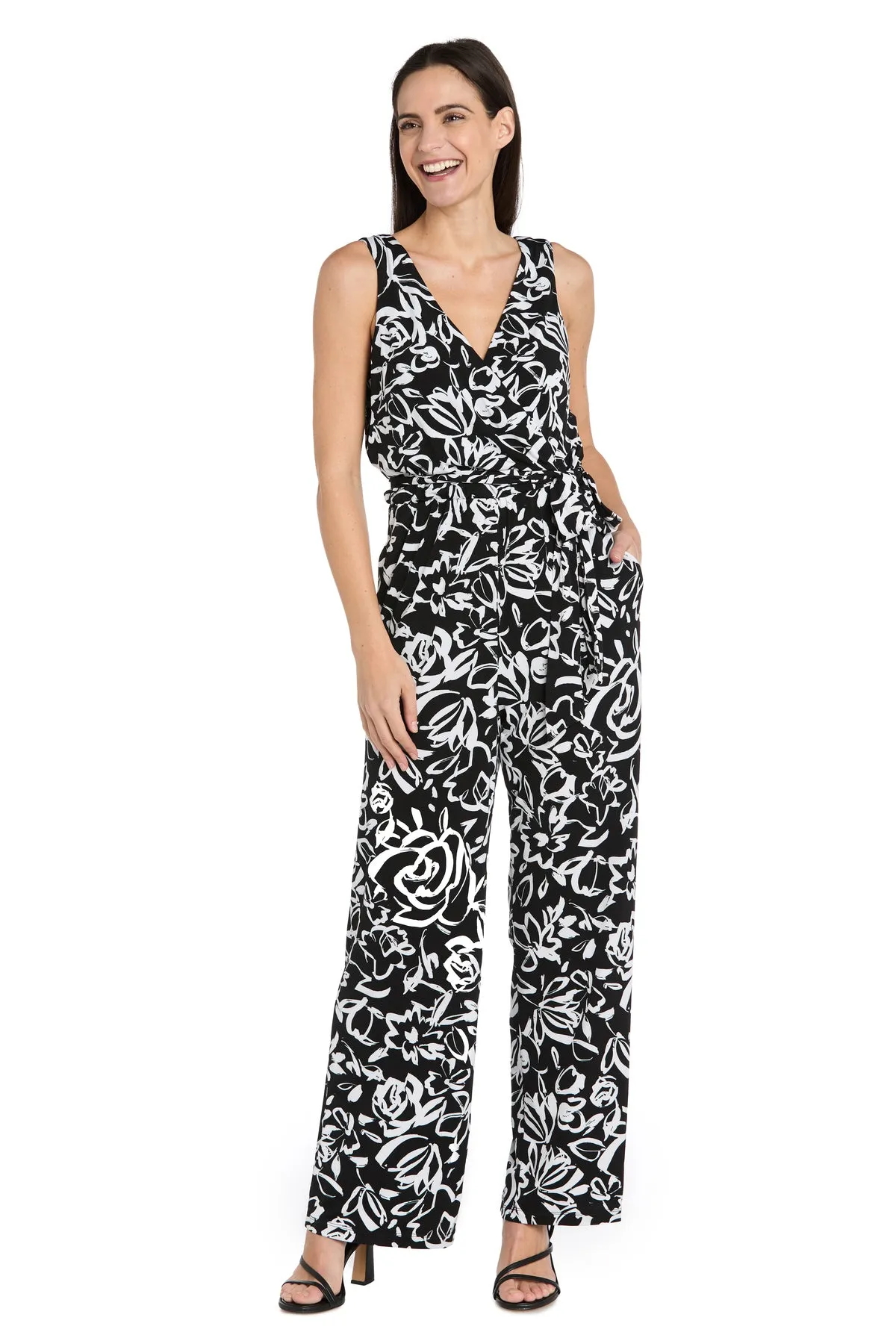 Chic Versatility: Black & White Patterned Cross-Over Jumpsuit sold by R&M Richards