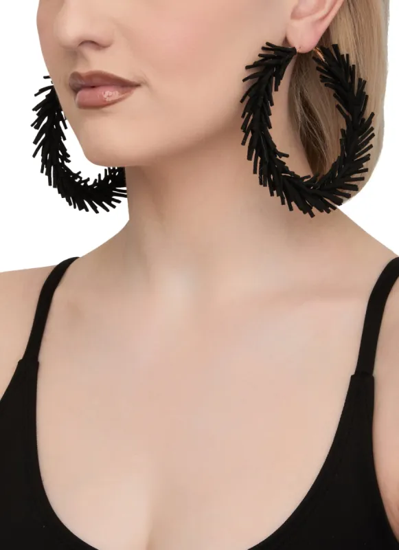 Solid Faux Suede Fringe Hoop Earrings sold by Rainbow