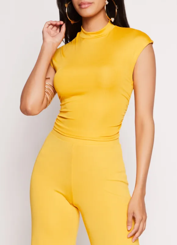 Ruched Mock Neck Cap Sleeve Top sold by Rainbow