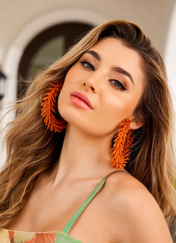 Faux Suede Fringed Hoop Earrings sold by Rainbow