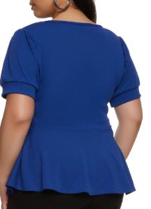 Plus Size Solid Crepe Knit Peplum Top sold by Rainbow