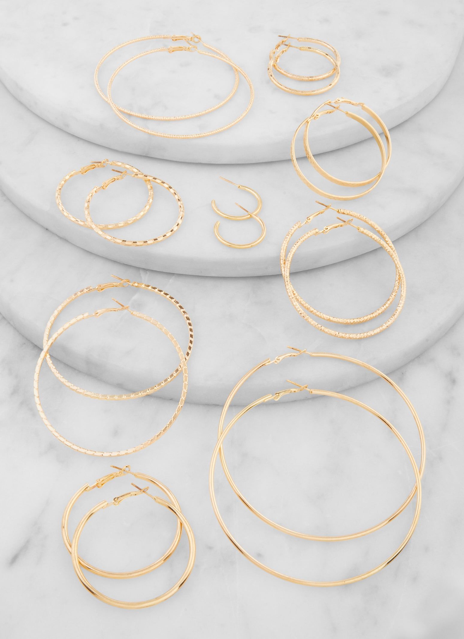 9 Pack Assorted Metallic Hoop Earrings sold by Rainbow
