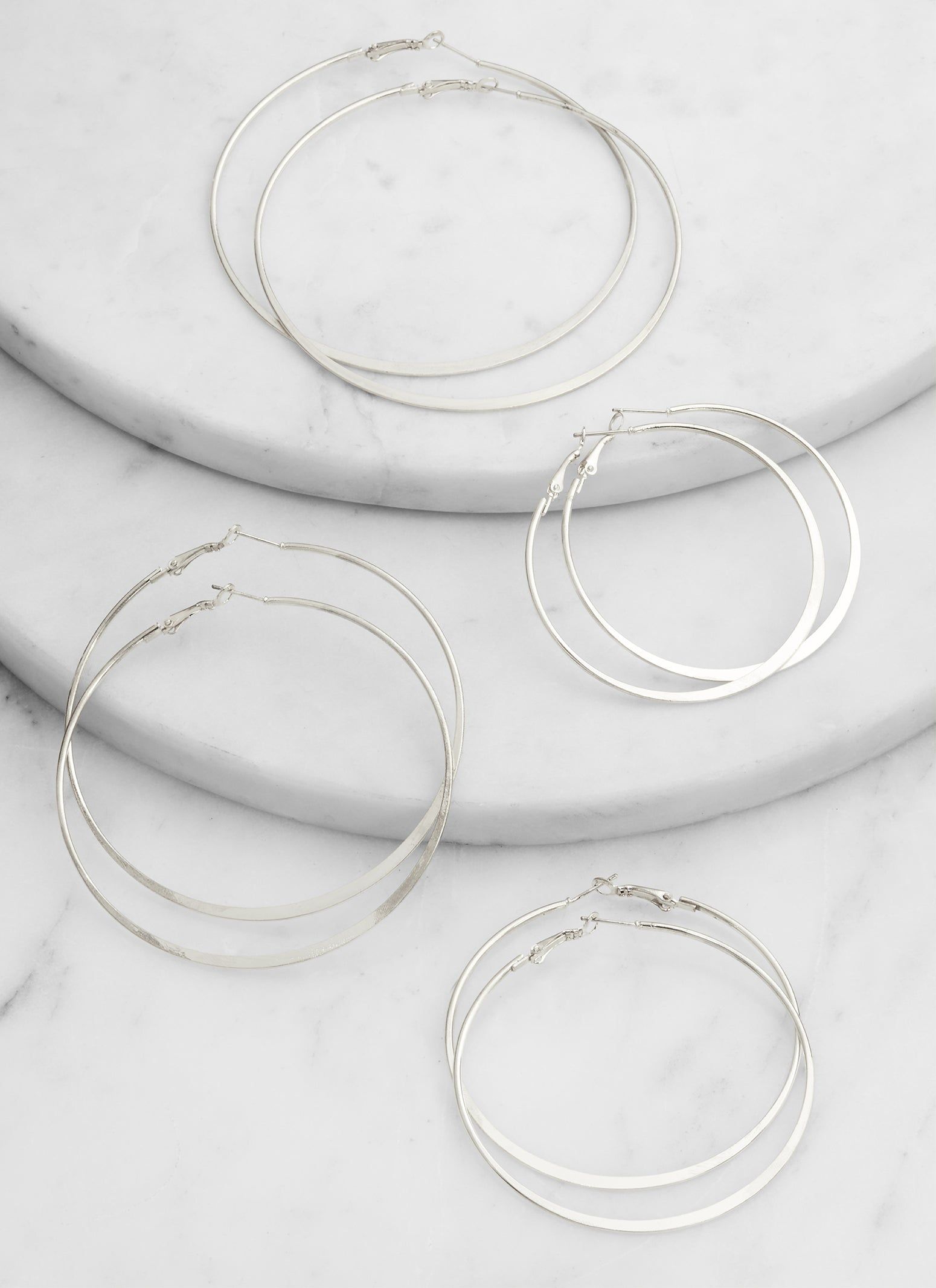 Set of 4 Metallic Hoop Earrings sold by Rainbow