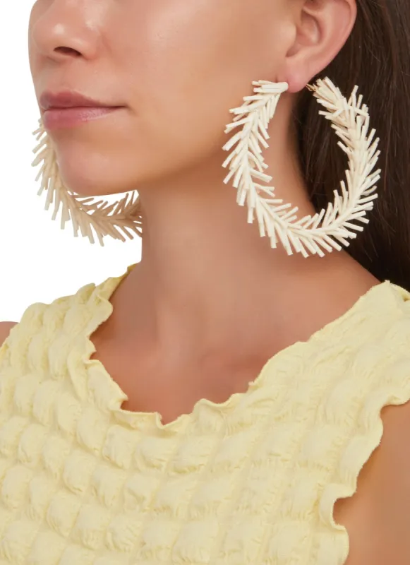 Faux Suede Fringed Hoop Earrings sold by Rainbow