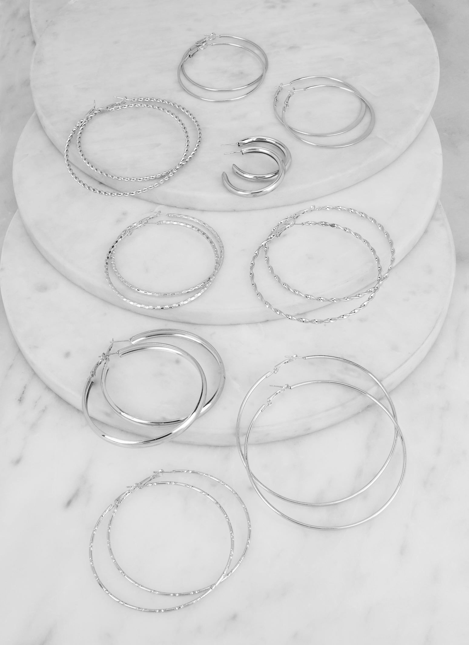 Hoop Earrings Set of 9 sold by Rainbow