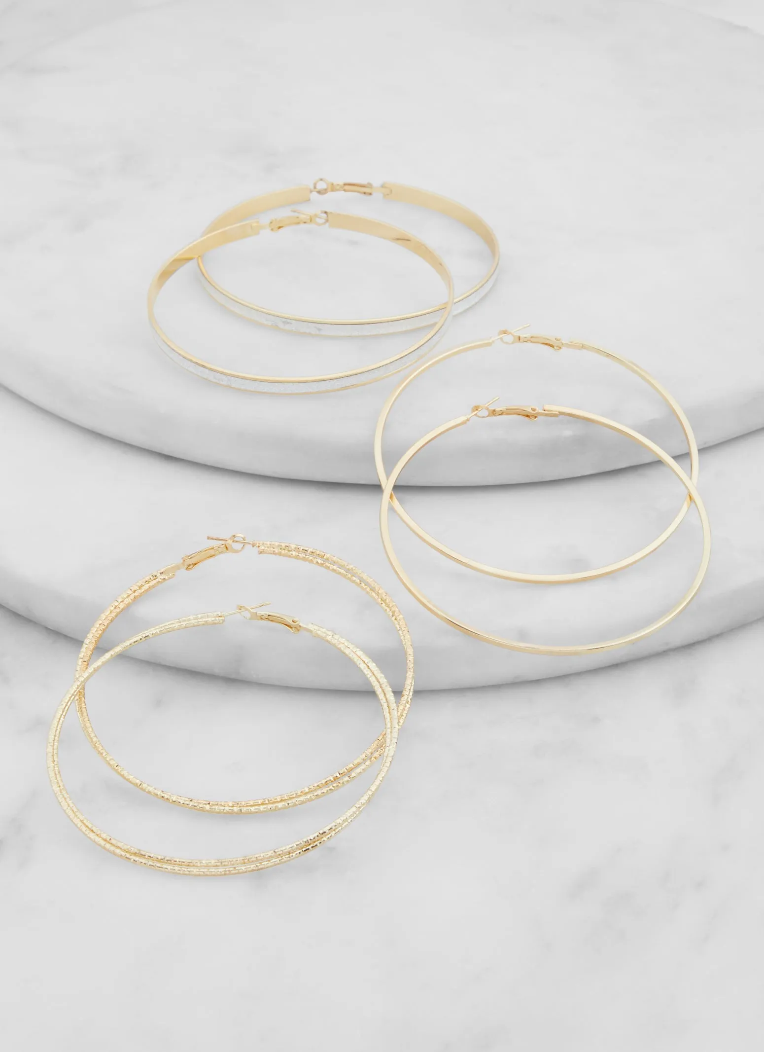 Assorted Glitter Hoop Earring Trio sold by Rainbow