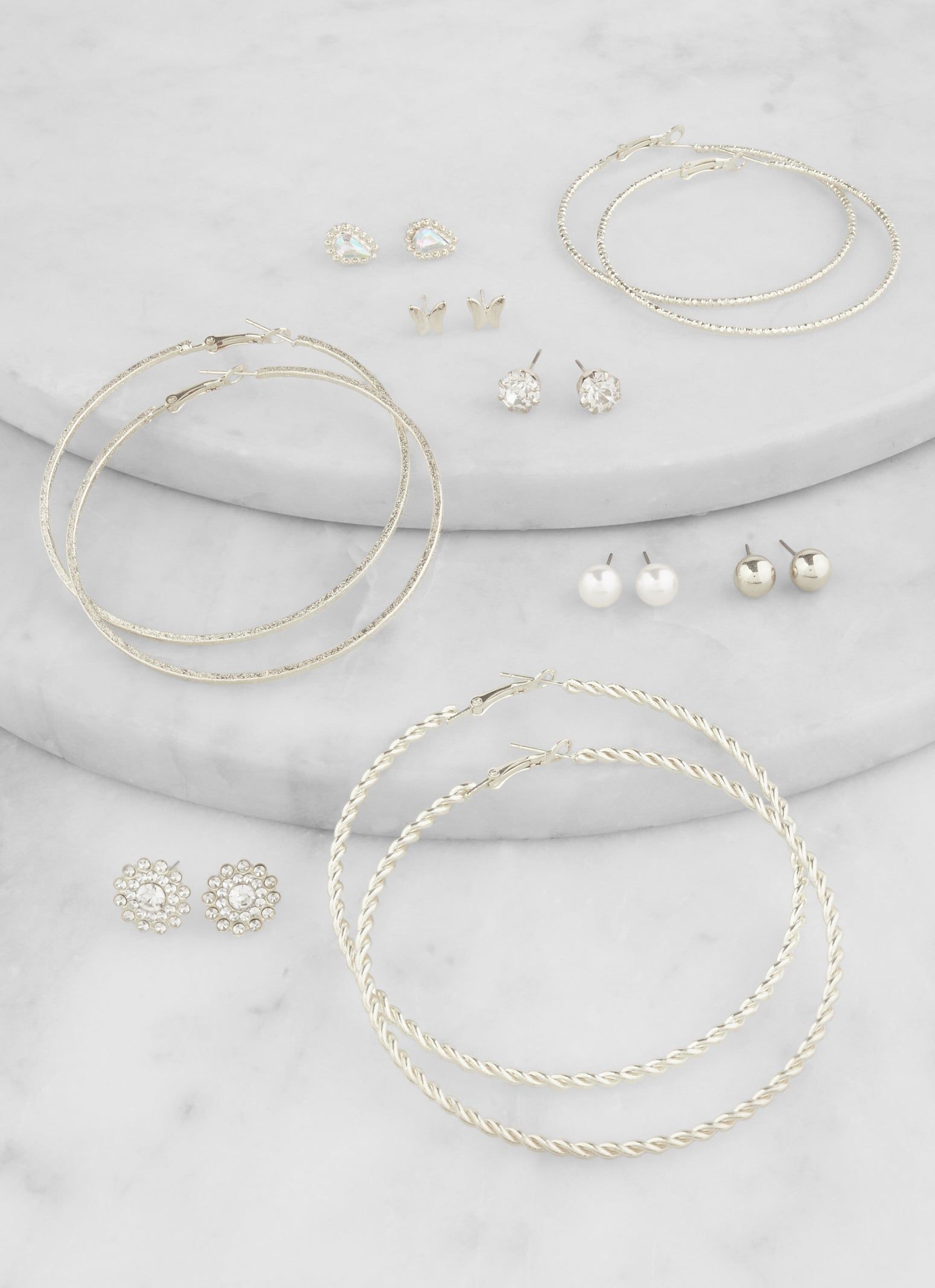 Set Of 9 Rhinestone Stud and Textured Hoop Earrings sold by Rainbow