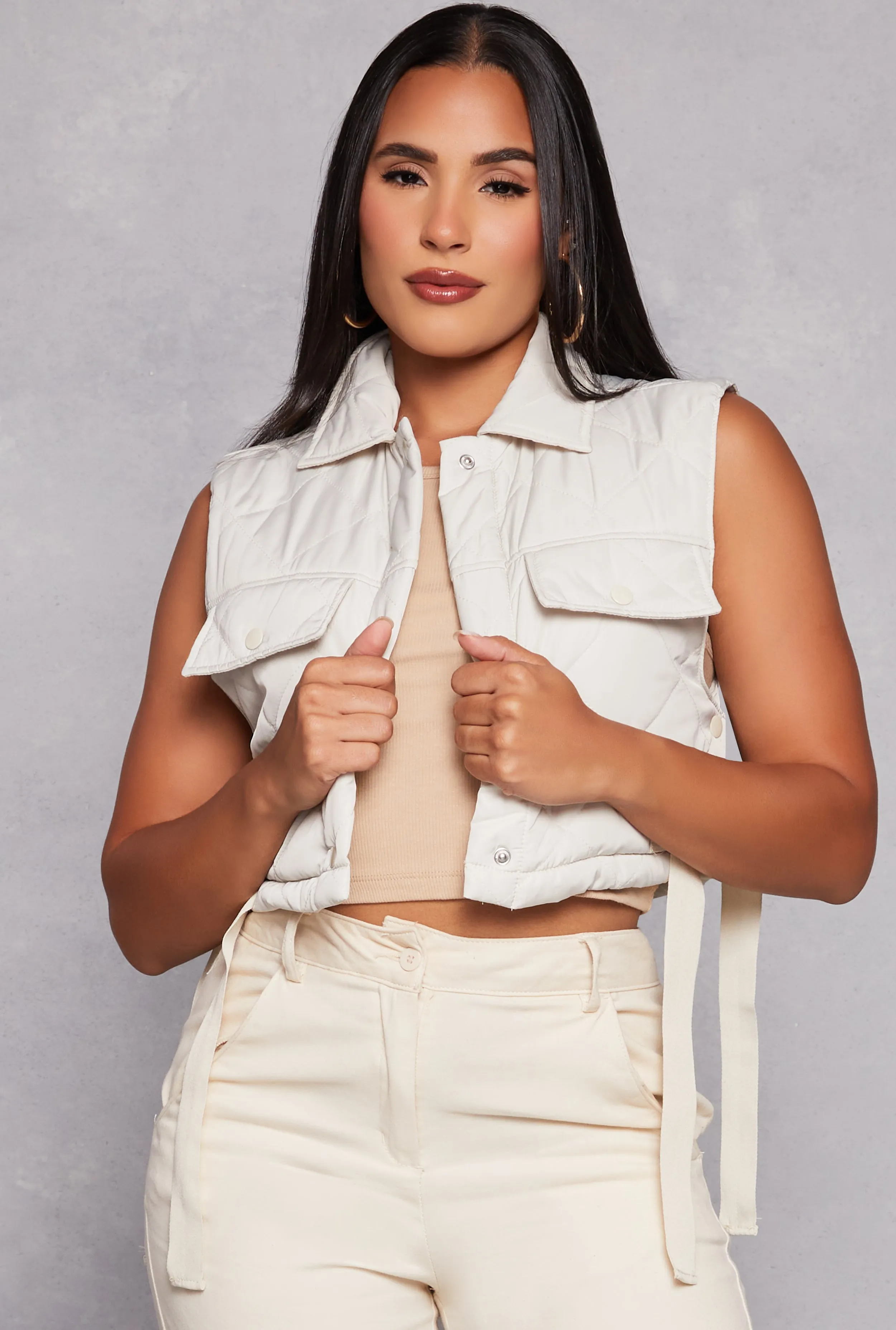 Almost Famous Quilted Snap Button Front Vest sold by Rainbow