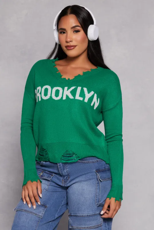 Brooklyn Graphic Distressed V Neck Sweater sold by Rainbow