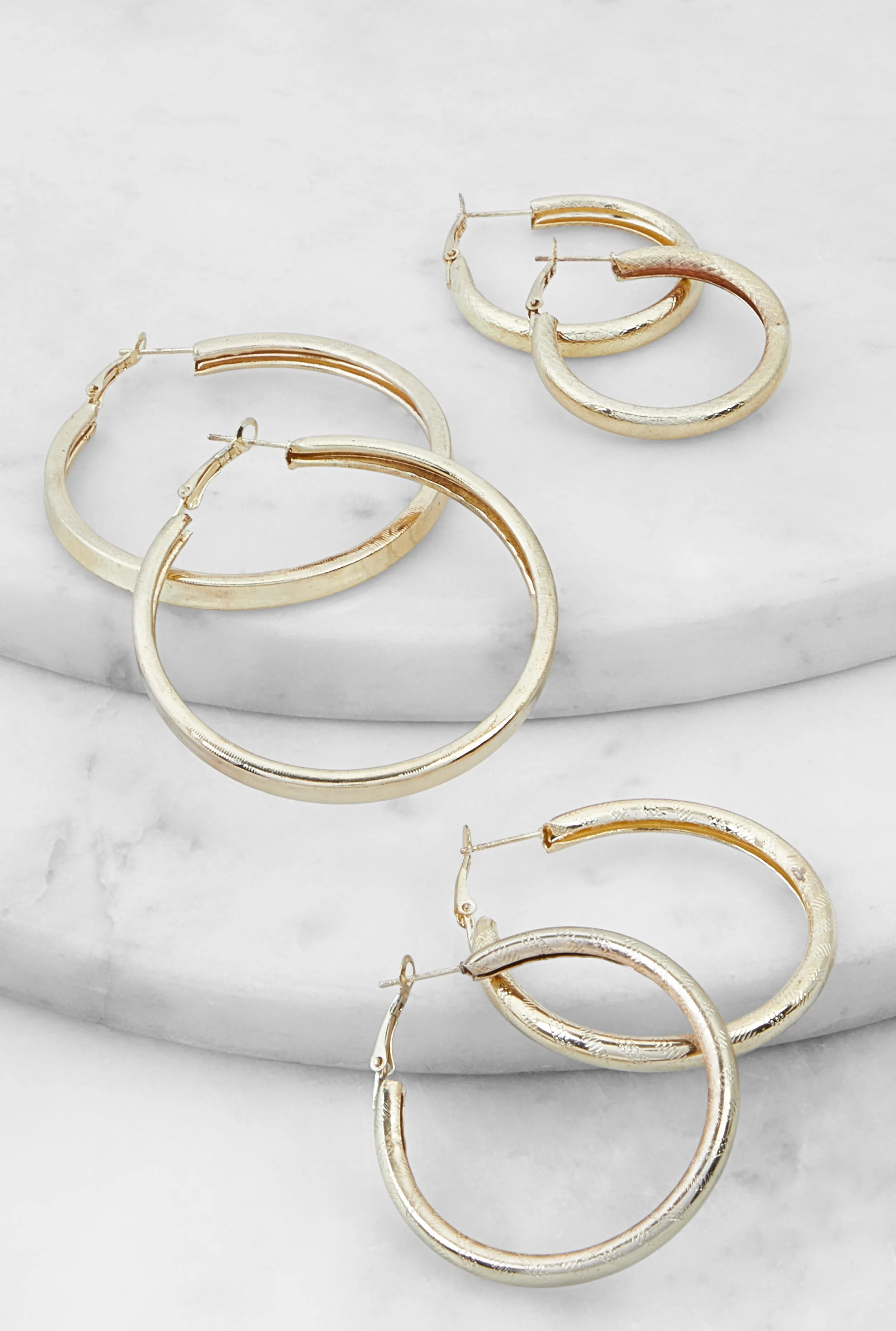 Metallic Textured Hoop Earrings Set of 3 sold by Rainbow