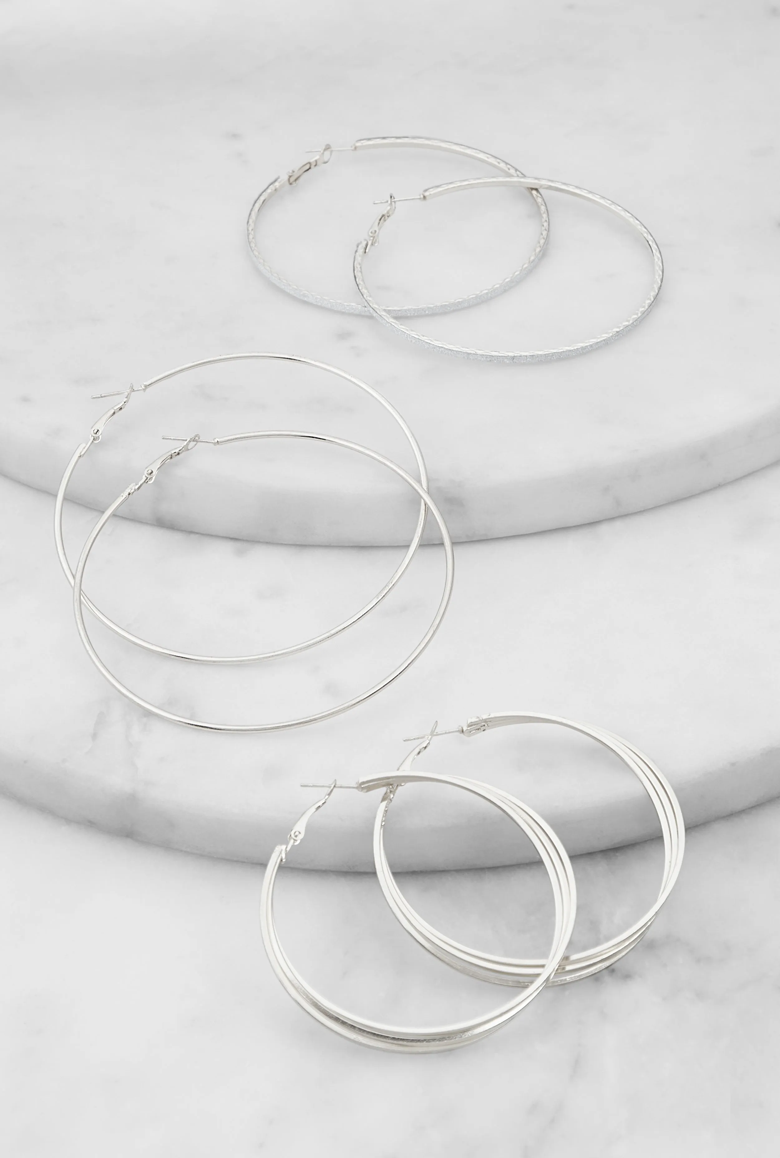 Metallic Hoop Earrings Set of 3 sold by Rainbow