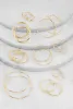 Textured Metallic Hoop Earrings Set of 9 sold by Rainbow