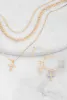Cubic Zirconia Cross Layered Necklace and Earrings Set sold by Rainbow